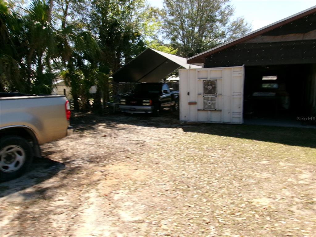 12525 Southeast 83rd Terrace Belleview, FL 34420 - Photo 14 of 47 a view of a house with a yard covered in snow