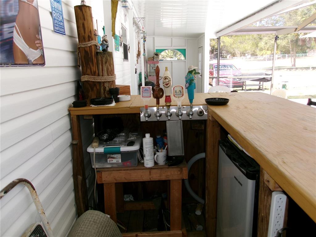 12525 Southeast 83rd Terrace Belleview, FL 34420 - Photo 25 of 47 a kitchen with a sink cabinets and window