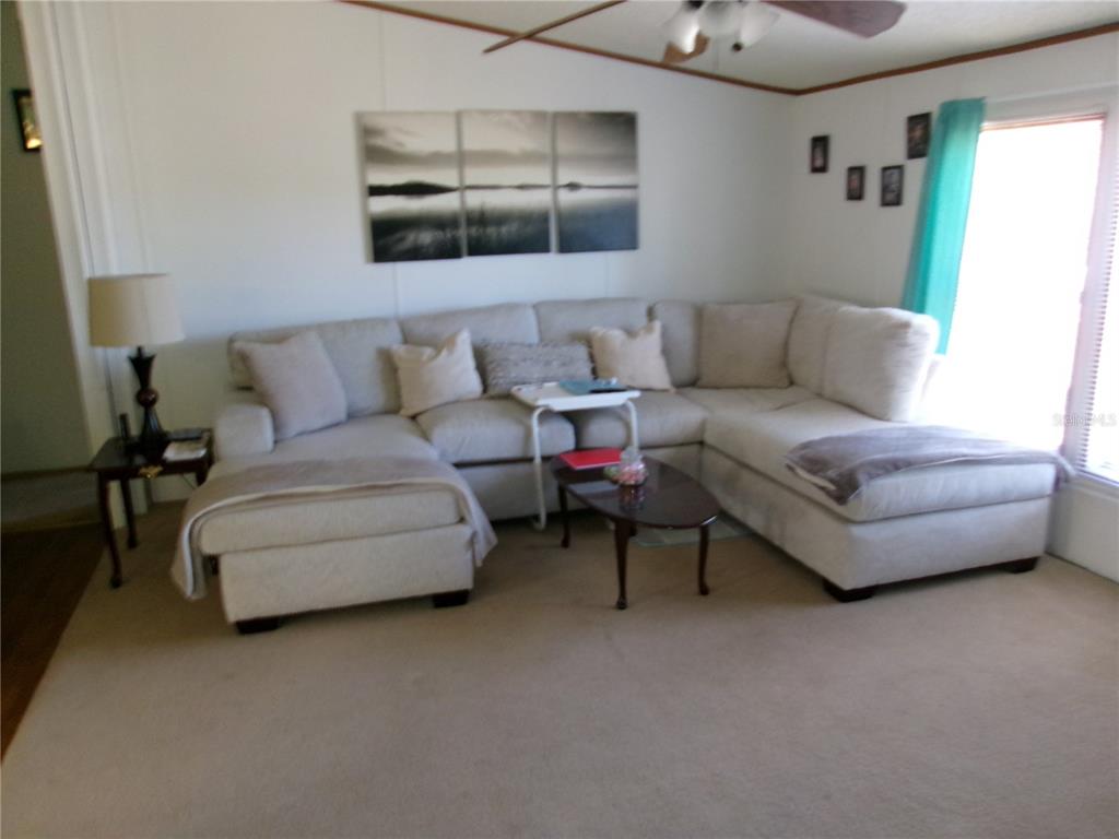 12525 Southeast 83rd Terrace Belleview, FL 34420 - Photo 32 of 47 a living room with furniture and a couch