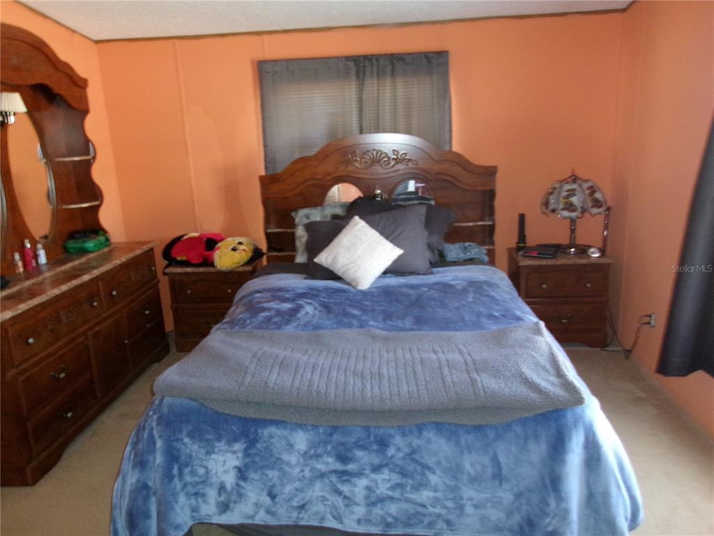 12525 Southeast 83rd Terrace Belleview, FL 34420 - Photo 35 of 47 a living room with a couch and dresser