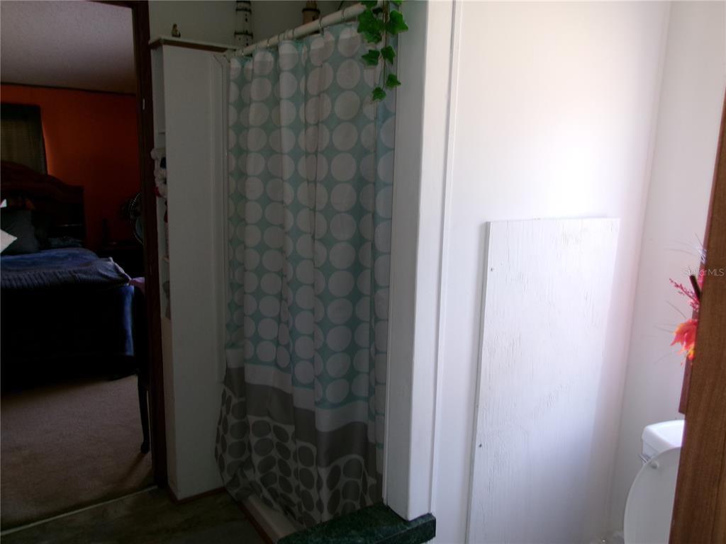 12525 Southeast 83rd Terrace Belleview, FL 34420 - Photo 41 of 47 a bathroom with a shower
