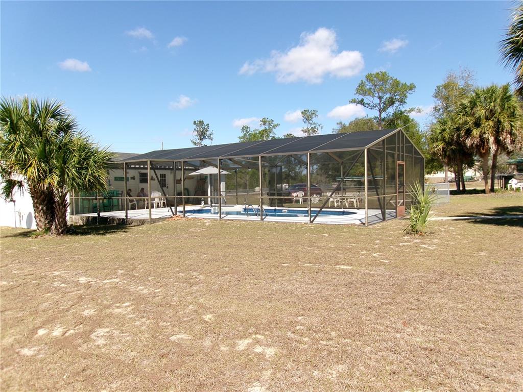 12525 Southeast 83rd Terrace Belleview, FL 34420 - Photo 8 of 47 a view of patio with swimming pool