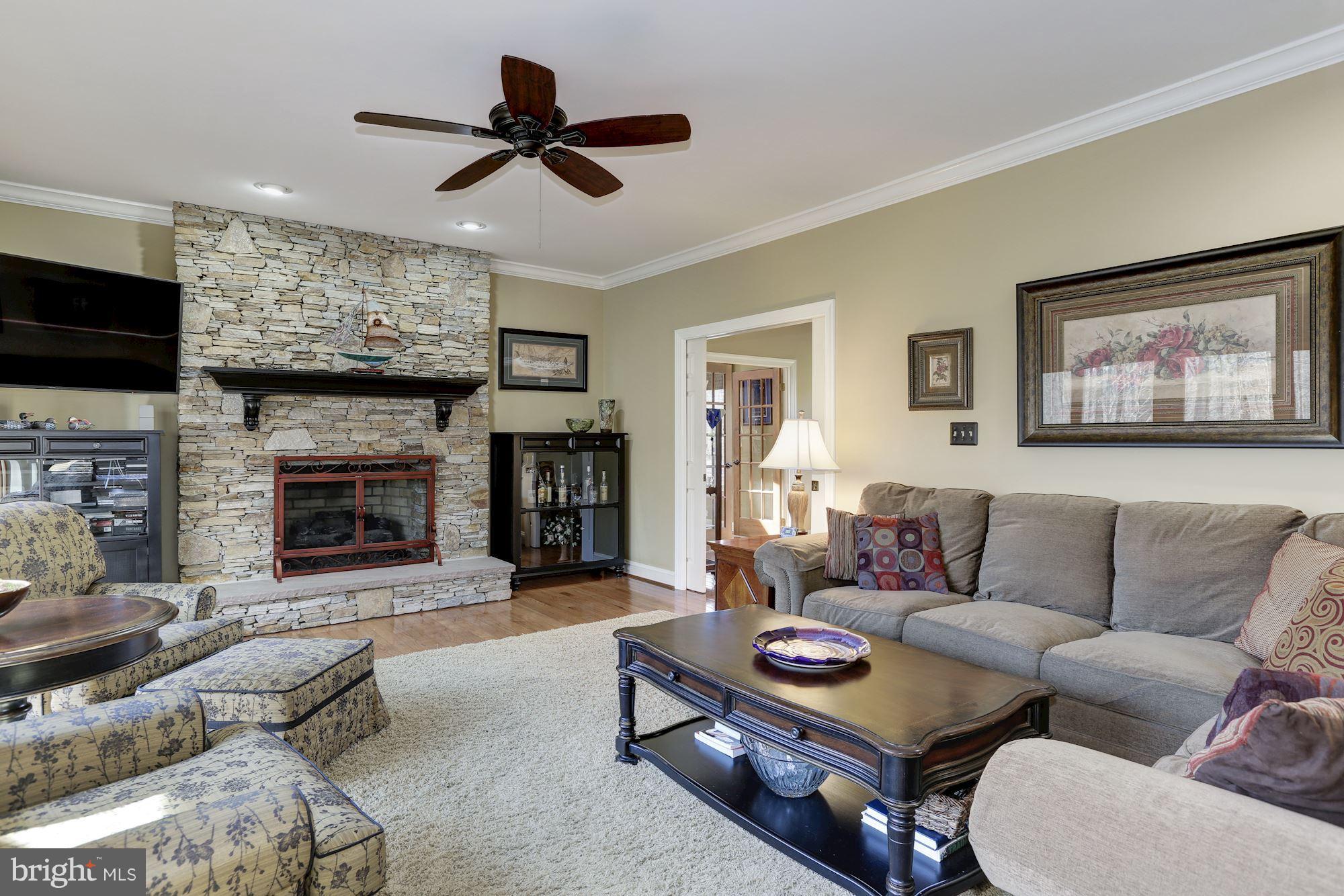 1705 Sinclair Road Gambrills, MD 21054 - Photo 14 of 82 Family room and gas fireplace with stone surround