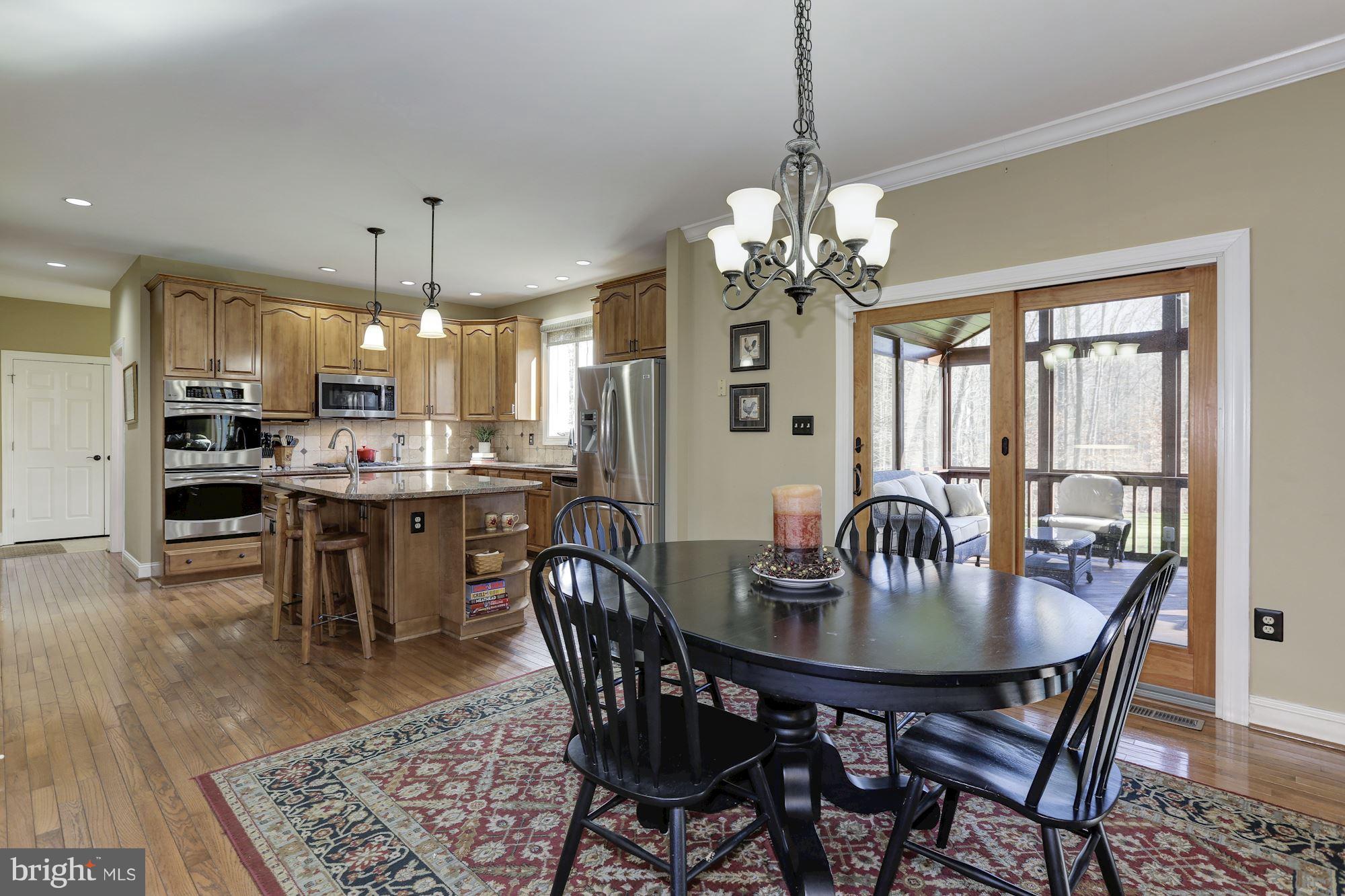 1705 Sinclair Road Gambrills, MD 21054 - Photo 16 of 82 Breakfast area and access to screened in porch