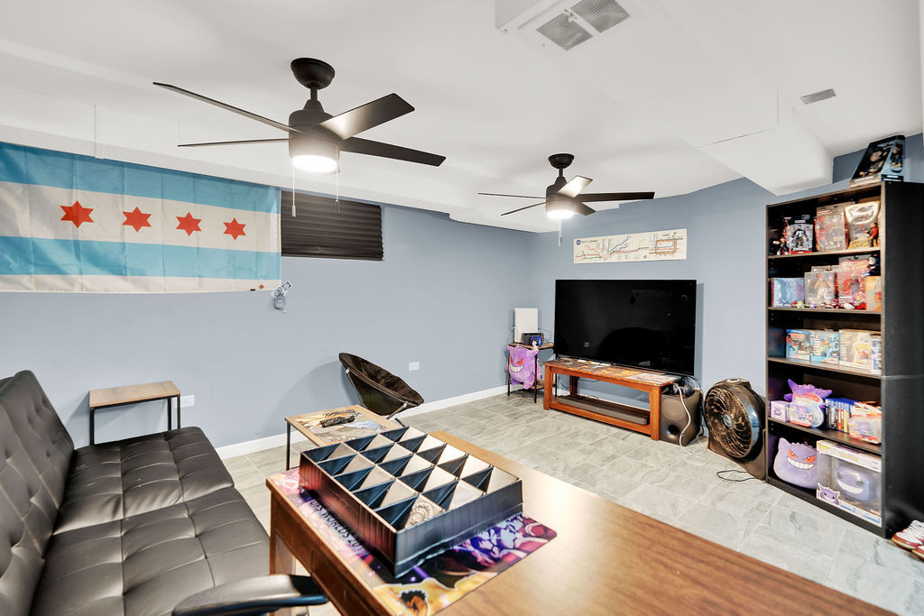7234 South Ridgeway Avenue Chicago, IL 60629 - Photo 17 of 27 a living room with furniture and a flat screen tv