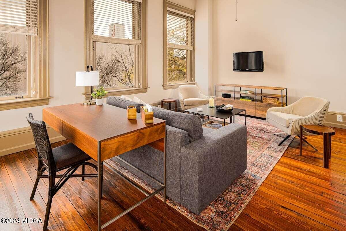 617 Cherry Street, Unit C Macon, GA 31201 - Photo 4 of 10 a living room with furniture and a flat screen tv