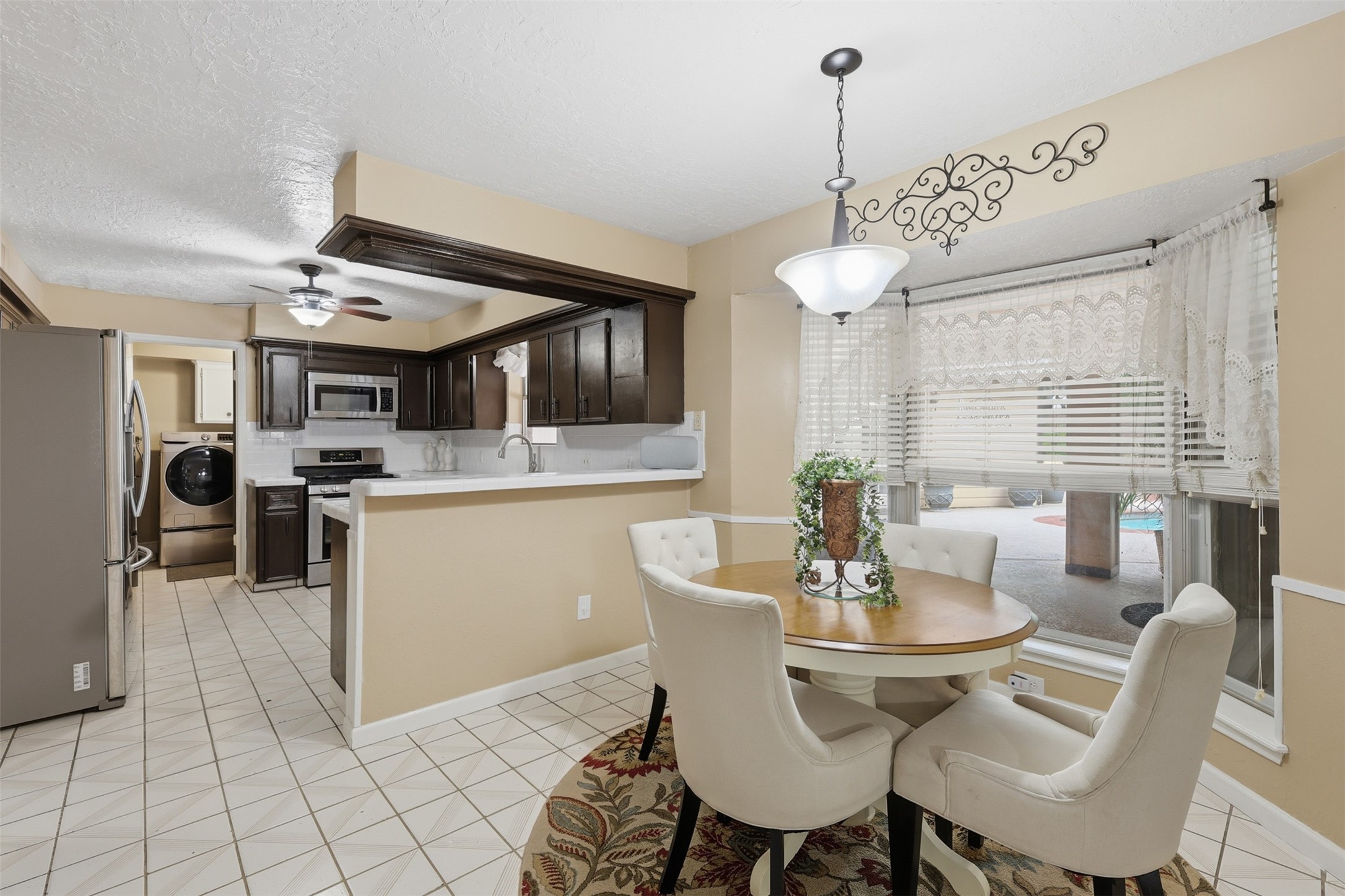 7010 River Mill Drive Spring, TX 77379 - Photo 10 of 29 a view of a dining room with furniture window and wooden floor