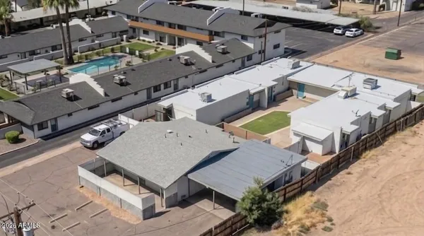 an aerial view of a house with a swimming pool