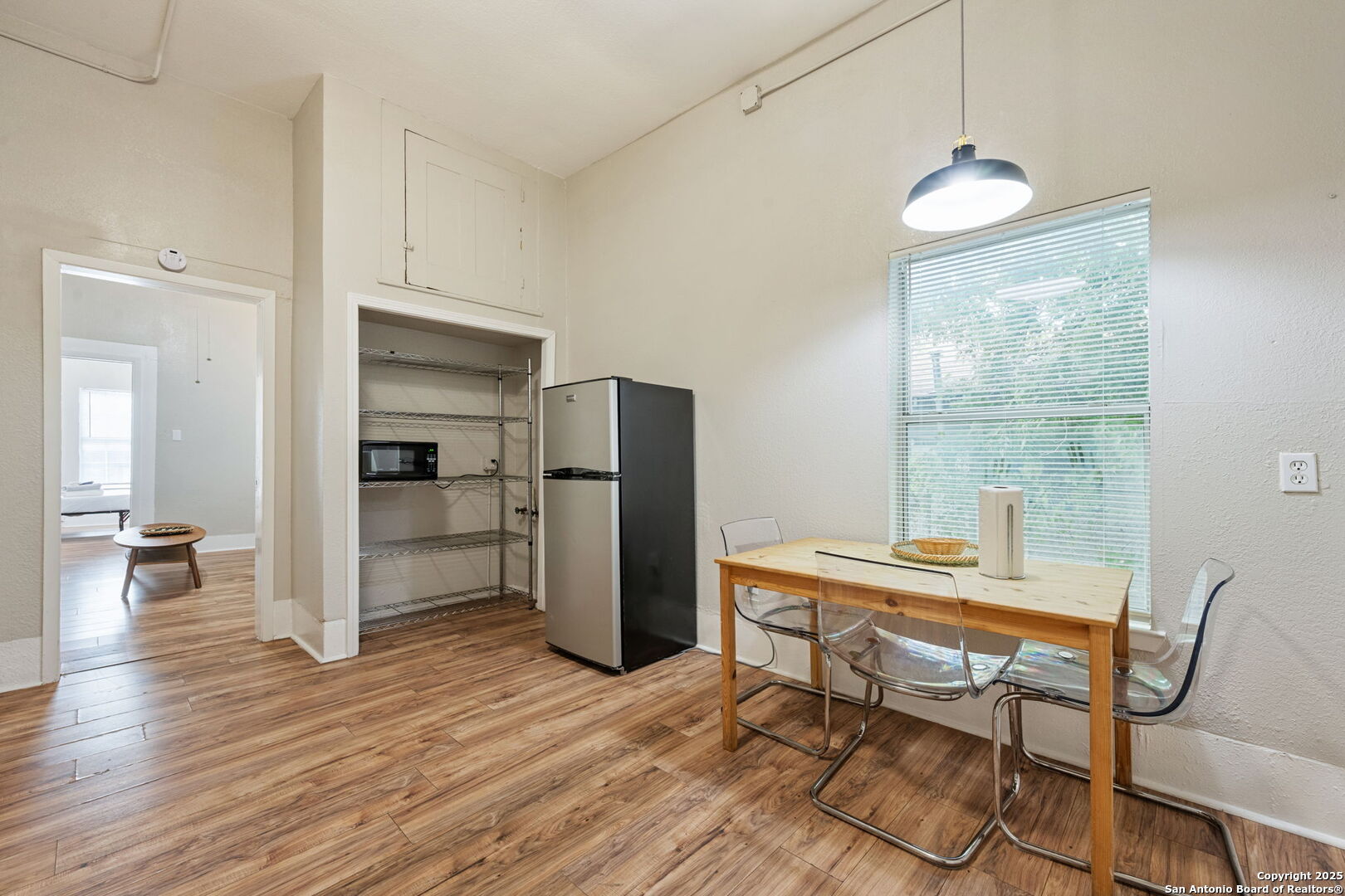 215 Blanco Road San Antonio, TX 78212 - Photo 11 of 48 a kitchen with stainless steel appliances wooden floor and chairs