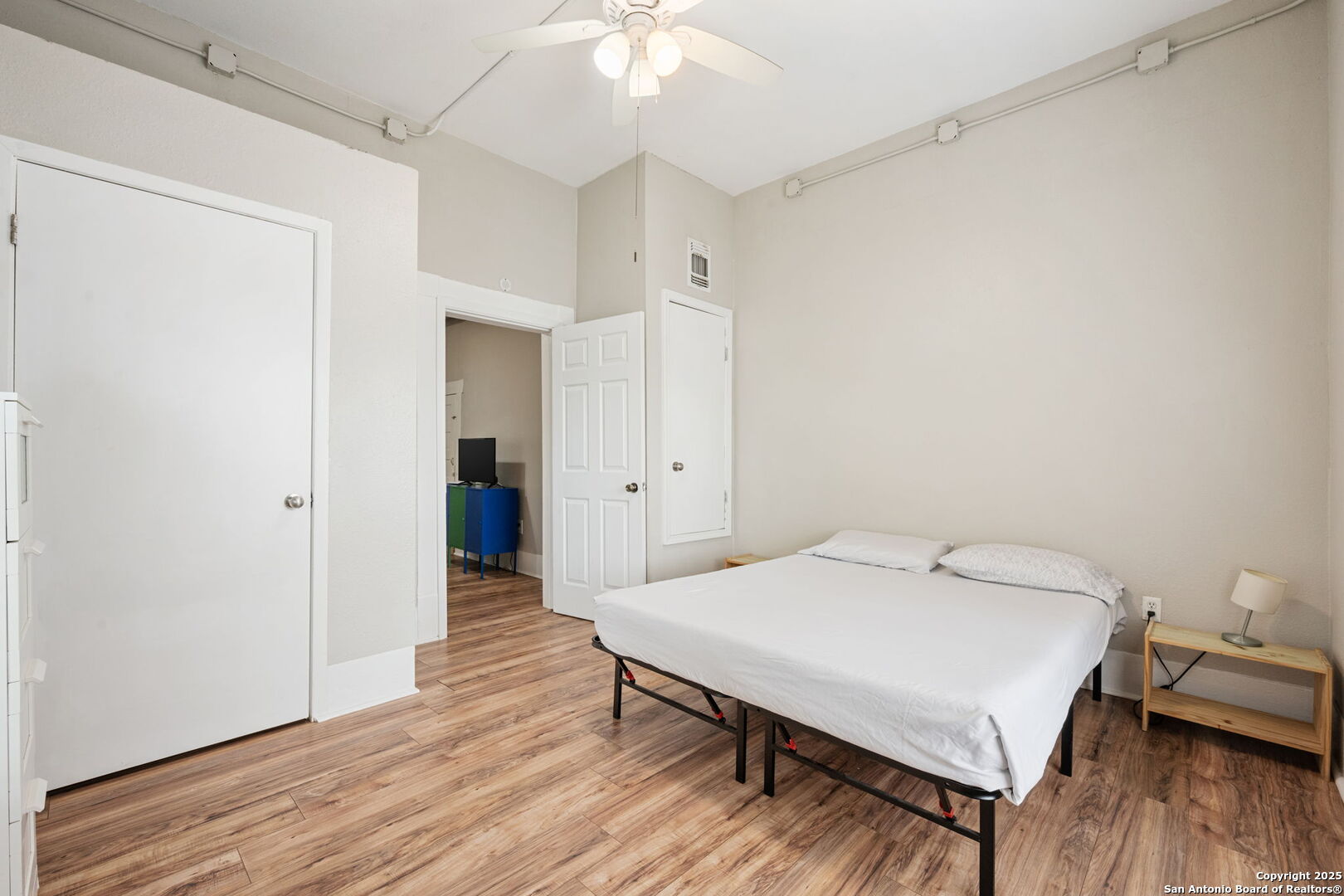 215 Blanco Road San Antonio, TX 78212 - Photo 14 of 48 a bedroom with a bed and a chandelier