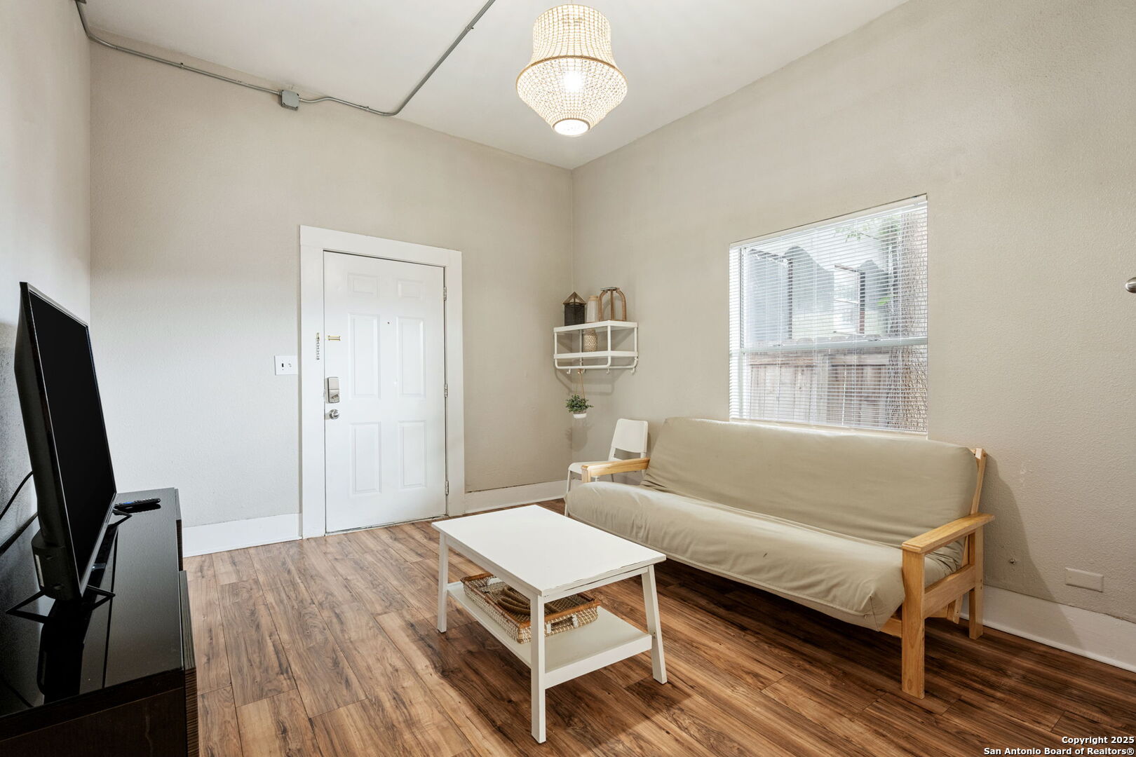 215 Blanco Road San Antonio, TX 78212 - Photo 18 of 48 a living room with a bed furniture and a window