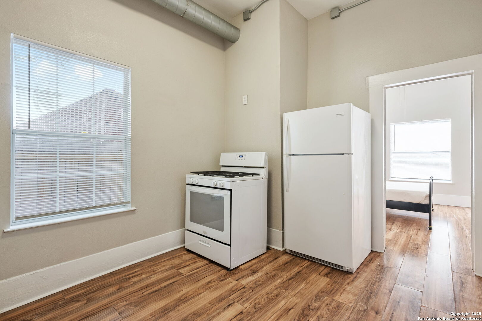 215 Blanco Road San Antonio, TX 78212 - Photo 22 of 48 a white refrigerator freezer and a stove sitting inside of a kitchen
