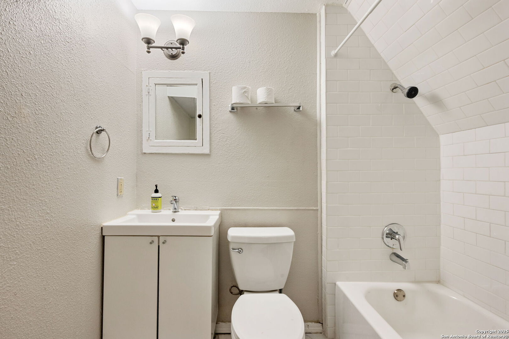 215 Blanco Road San Antonio, TX 78212 - Photo 25 of 48 a bathroom with a toilet sink and mirror