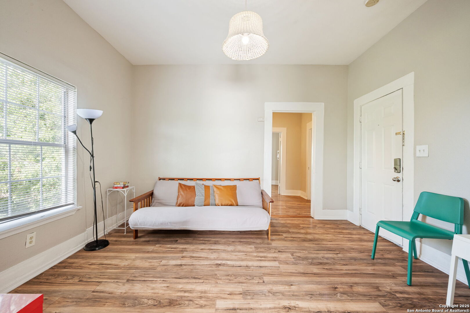 215 Blanco Road San Antonio, TX 78212 - Photo 29 of 48 a bedroom with a bed and wooden floor