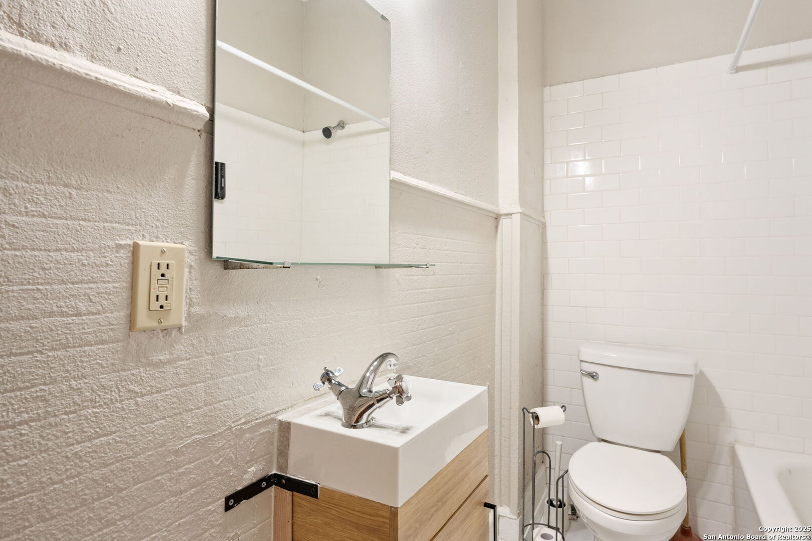 215 Blanco Road San Antonio, TX 78212 - Photo 35 of 48 a white toilet sitting next to a bathroom sink