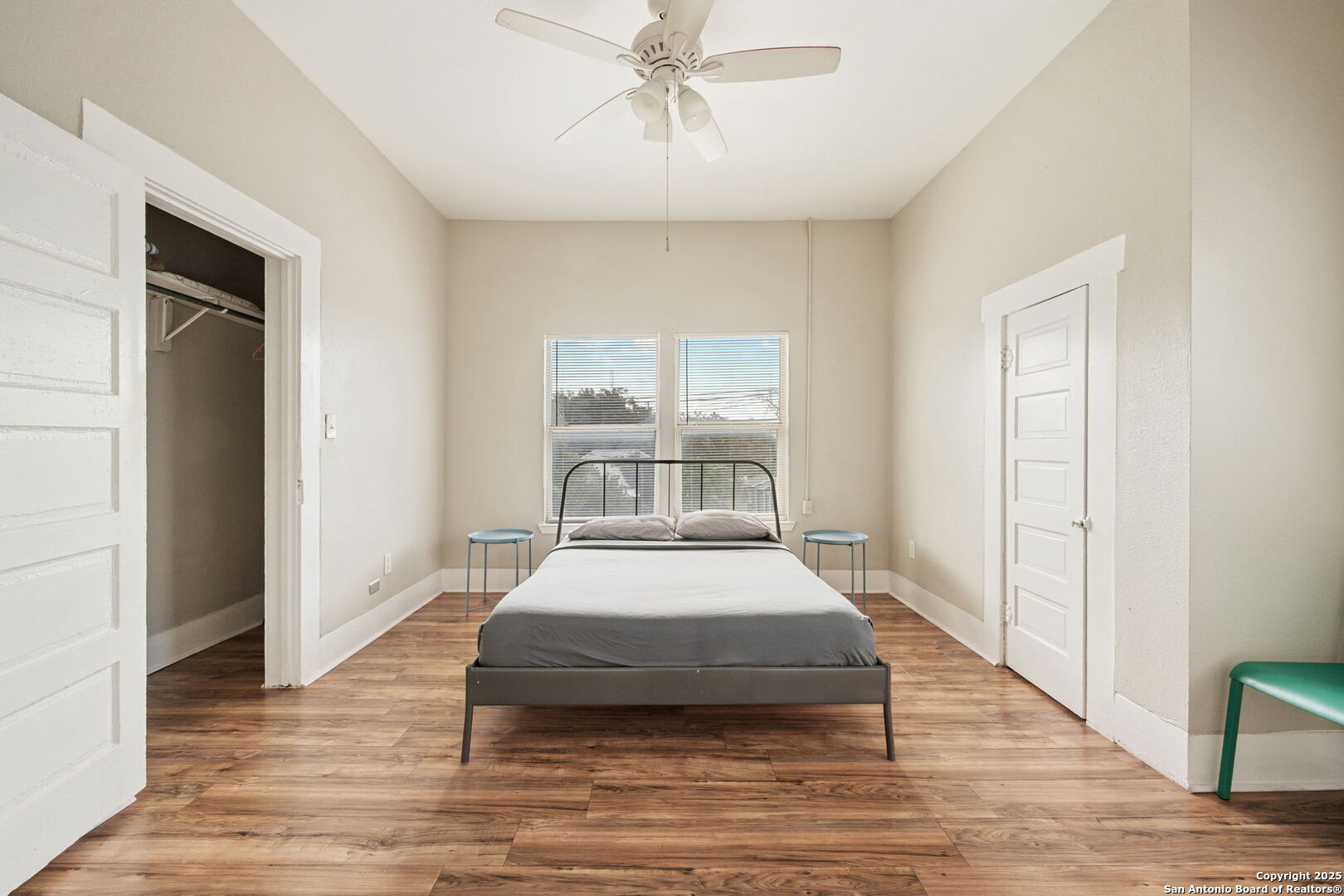 215 Blanco Road San Antonio, TX 78212 - Photo 36 of 48 a bedroom with a bed and wooden floor