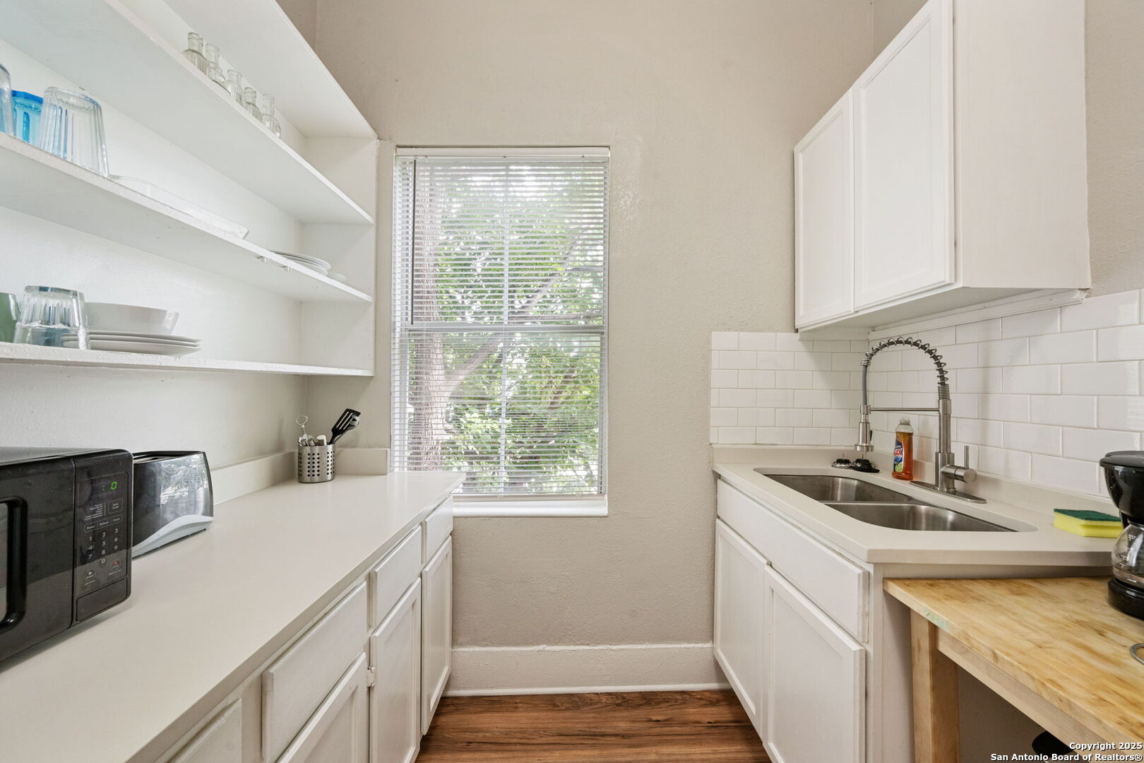 215 Blanco Road San Antonio, TX 78212 - Photo 43 of 48 a kitchen with a sink and cabinets
