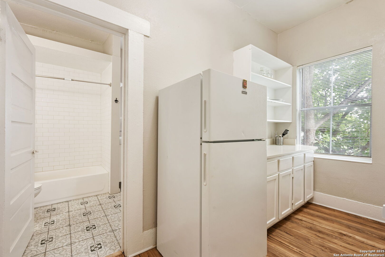 215 Blanco Road San Antonio, TX 78212 - Photo 44 of 48 a white refrigerator freezer sitting inside of a kitchen