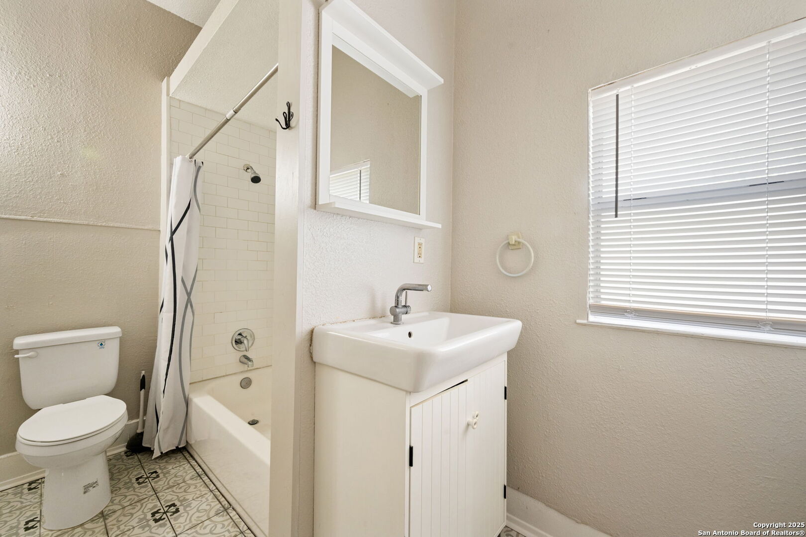 215 Blanco Road San Antonio, TX 78212 - Photo 47 of 48 a bathroom with a sink a toilet and a mirror