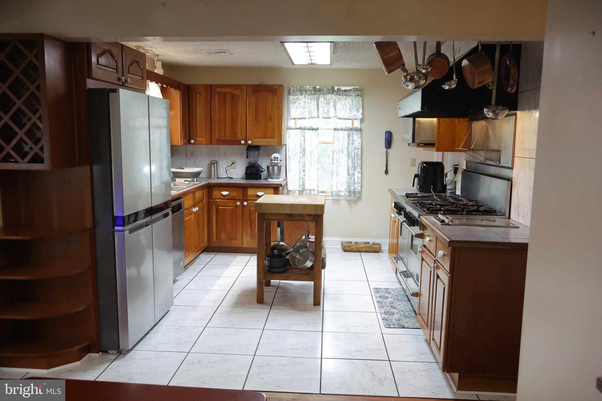 1784 Old Trenton Road West Windsor, NJ 08550 - Photo 12 of 29 a kitchen with stainless steel appliances granite countertop a refrigerator and a stove top oven