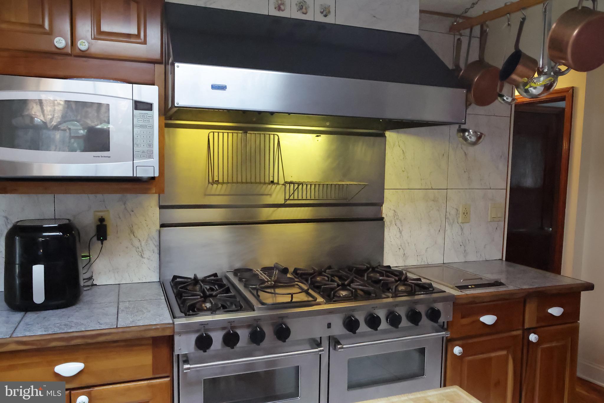 1784 Old Trenton Road West Windsor, NJ 08550 - Photo 13 of 29 a stove top oven sitting inside of a kitchen