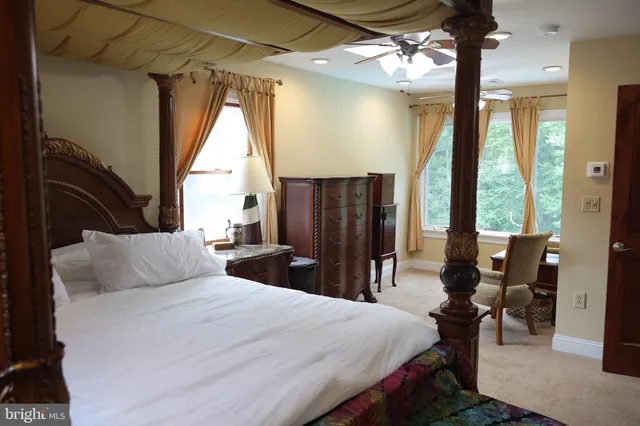 a white toilet sitting next to a shower