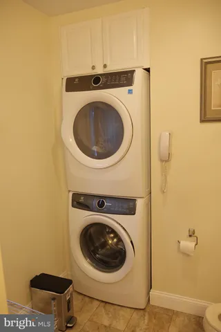 a bathroom with a shower curtain and a sink