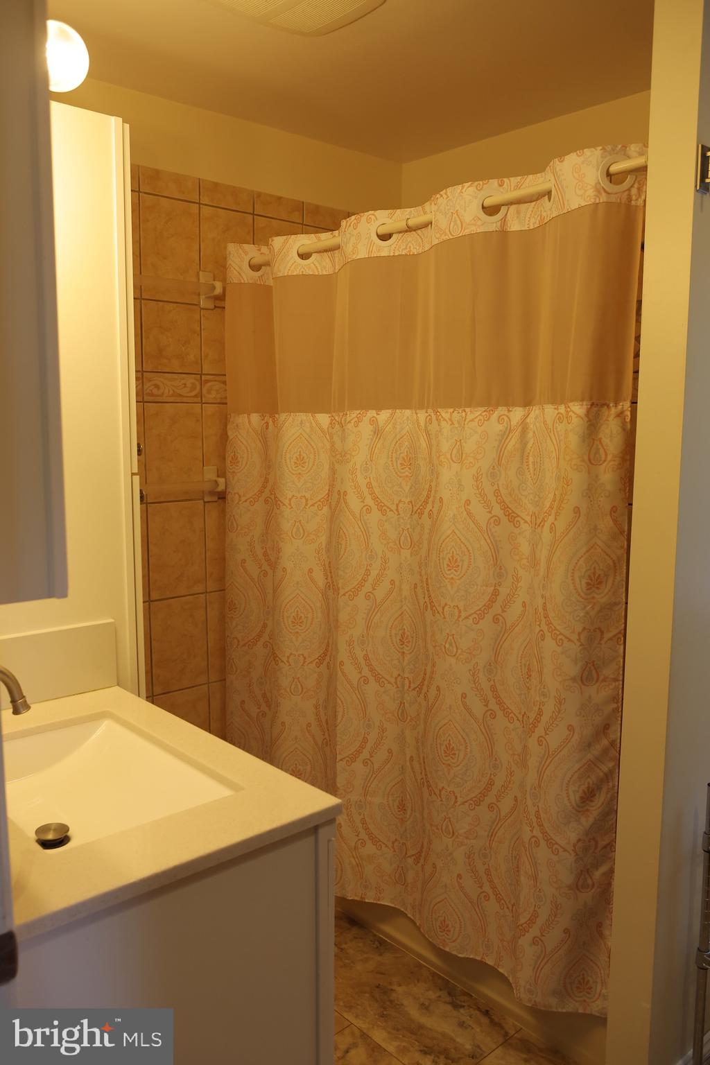 1784 Old Trenton Road West Windsor, NJ 08550 - Photo 25 of 29 a bathroom with a shower curtain and a sink