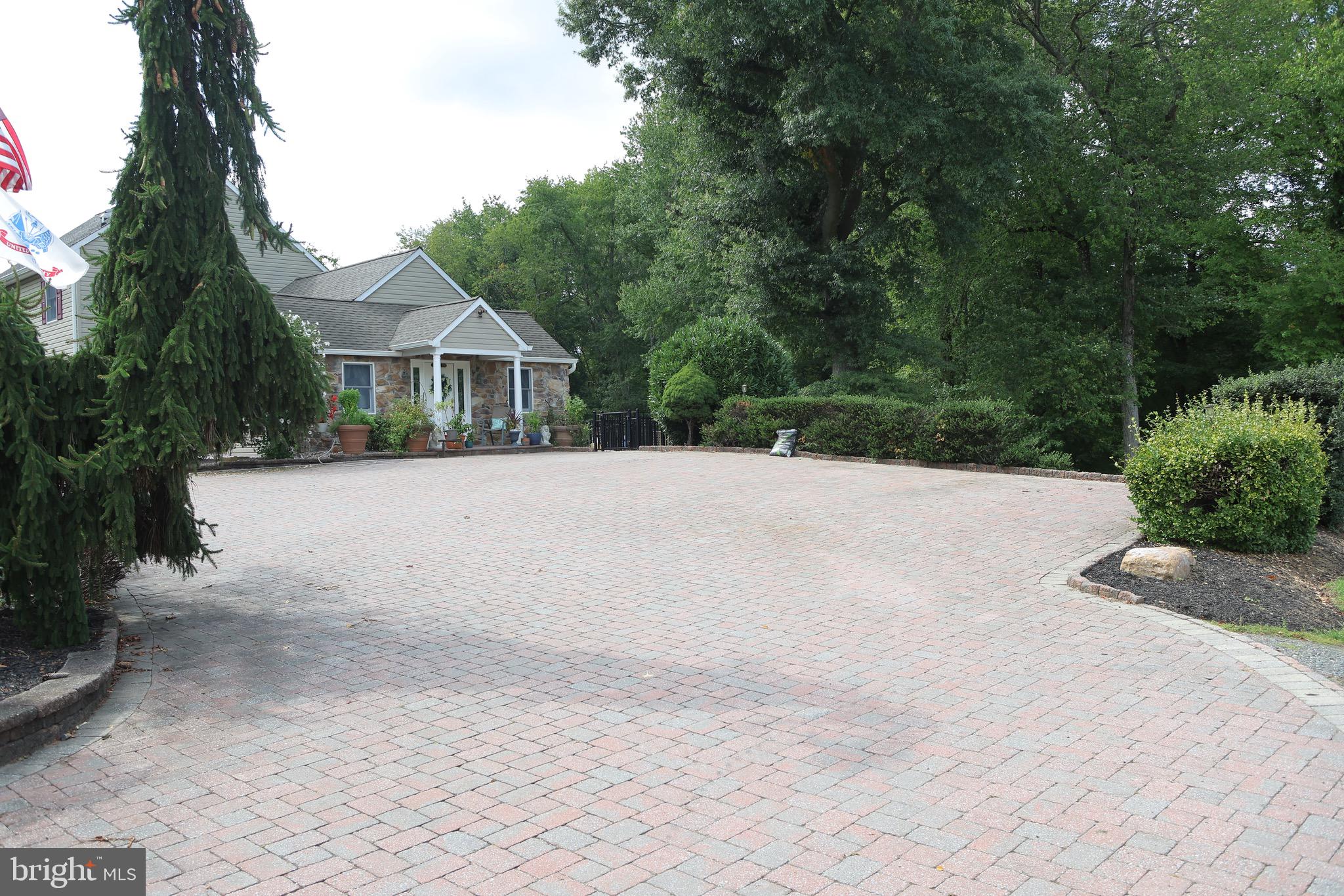 1784 Old Trenton Road West Windsor, NJ 08550 - Photo 4 of 29 a front view of a house with a yard and trees