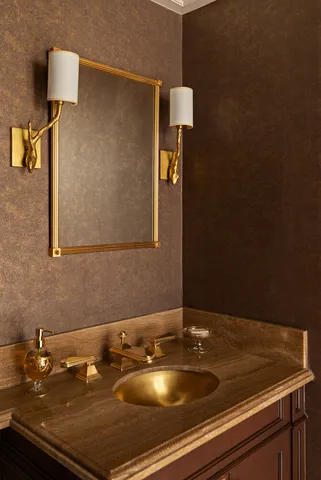 a bathroom with a toilet a sink and a mirror