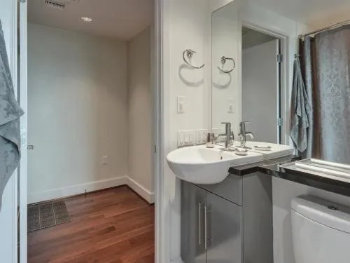 a bathroom with a sink and a mirror