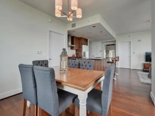 a view of a dining room with furniture and wooden floor