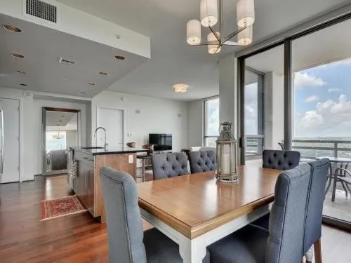 a view of a dining room with furniture window and wooden floor