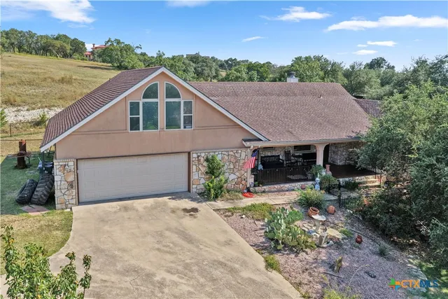 a house with trees in the background