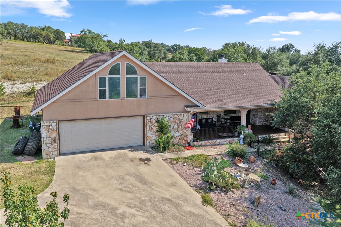 306 Alexander Avenue Burnet, TX 78611 - Photo 1 of 38 a house with trees in the background