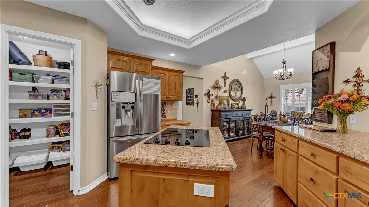 306 Alexander Avenue Burnet, TX 78611 - Photo 12 of 38 a kitchen with stainless steel appliances granite countertop sink stove and refrigerator