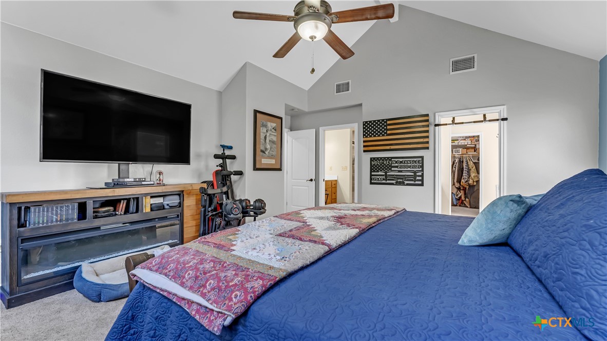 306 Alexander Avenue Burnet, TX 78611 - Photo 24 of 38 a living room with furniture and a flat screen tv