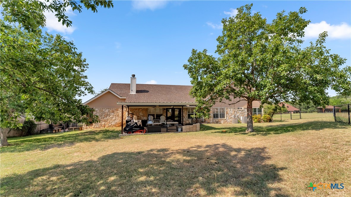 306 Alexander Avenue Burnet, TX 78611 - Photo 32 of 38 a view of a house with a yard and tree s