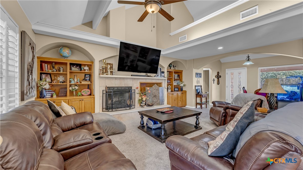 306 Alexander Avenue Burnet, TX 78611 - Photo 6 of 38 a living room with furniture fireplace and flat screen tv