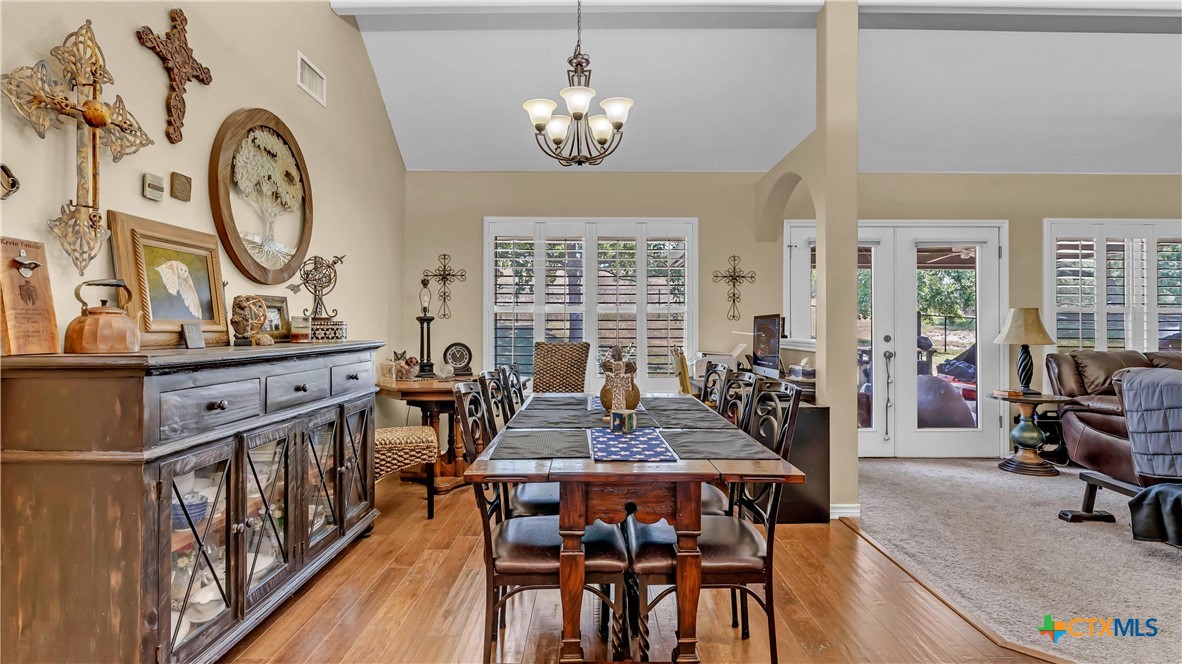 306 Alexander Avenue Burnet, TX 78611 - Photo 9 of 38 a view of a dining room with furniture window and wooden floor