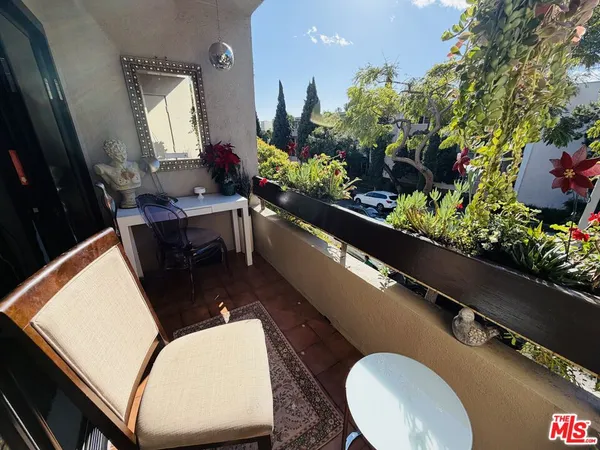 a view of balcony and yard
