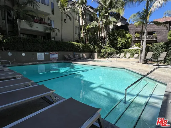 a bathroom with a sink mirror and vanity