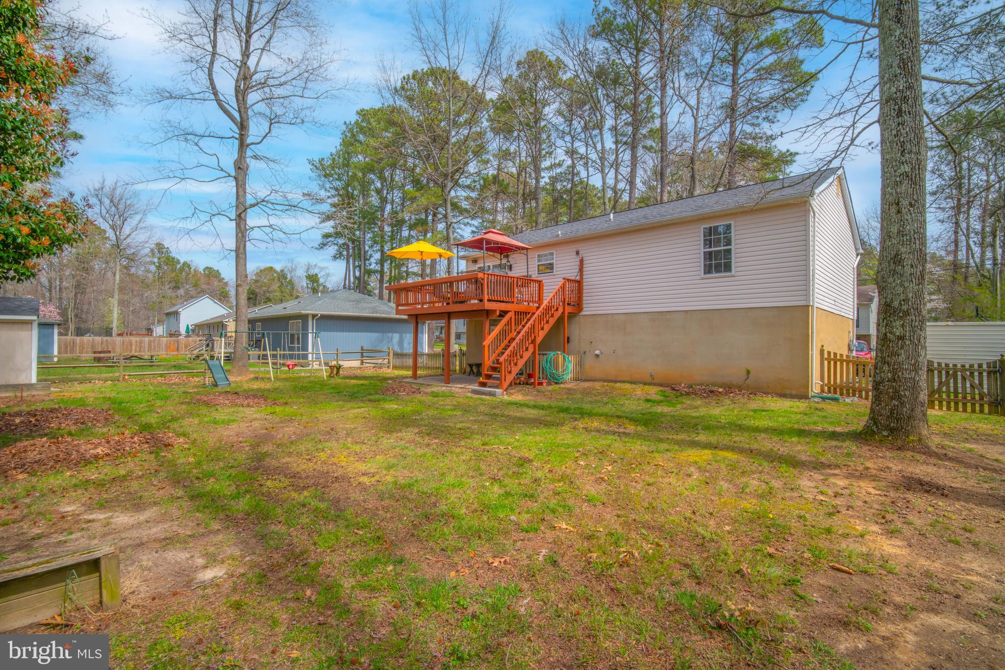 11551 San Rafael Road Lusby, MD 20657 - Photo 27 of 31 a view of a house with a back yard