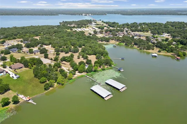 an aerial view of a houses with lake view