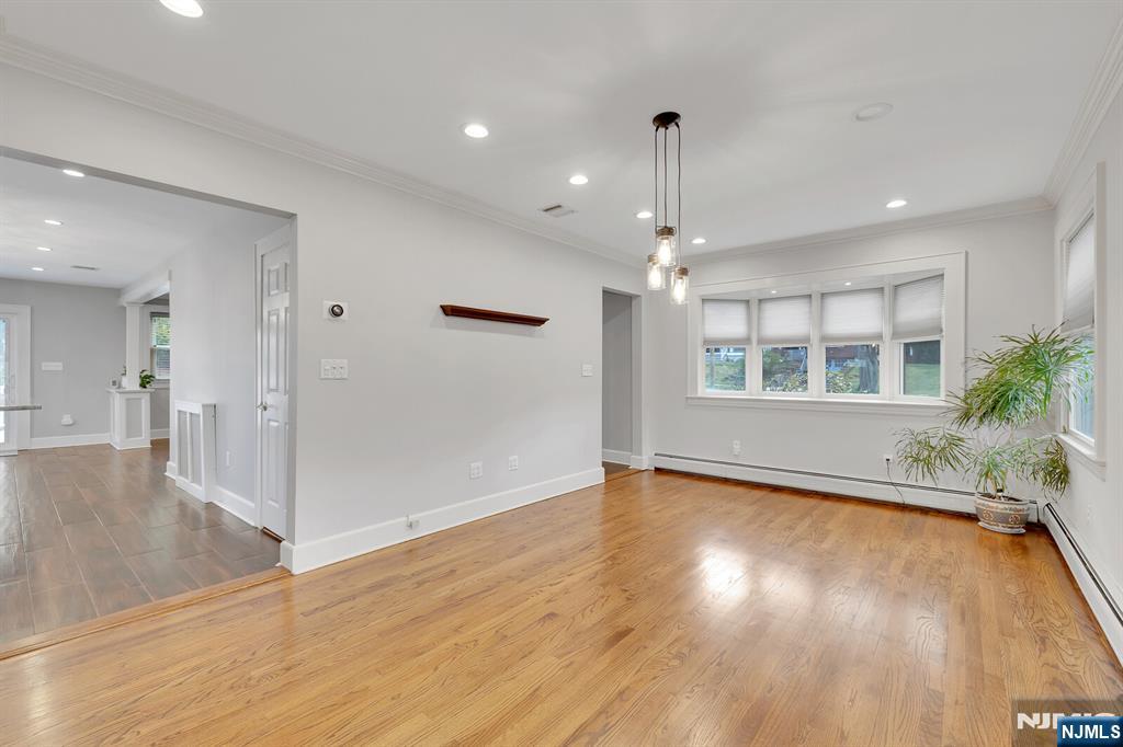 346 Carmita Avenue Rutherford, NJ 07070 - Photo 15 of 47 a view of an empty room with window and wooden floor