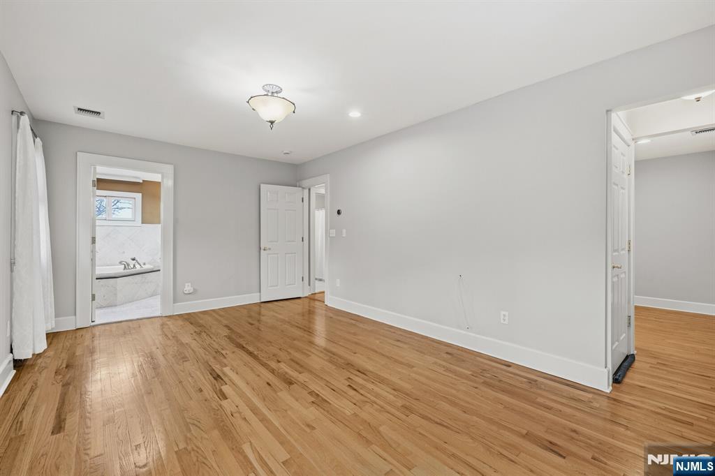 346 Carmita Avenue Rutherford, NJ 07070 - Photo 21 of 47 a view of an empty room with wooden floor