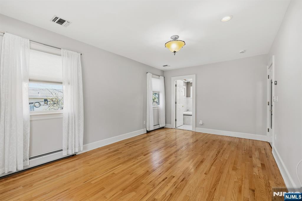 346 Carmita Avenue Rutherford, NJ 07070 - Photo 23 of 47 a view of an empty room with wooden floor