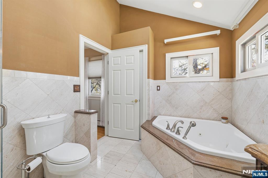 346 Carmita Avenue Rutherford, NJ 07070 - Photo 25 of 47 a bathroom with a toilet and a bathtub