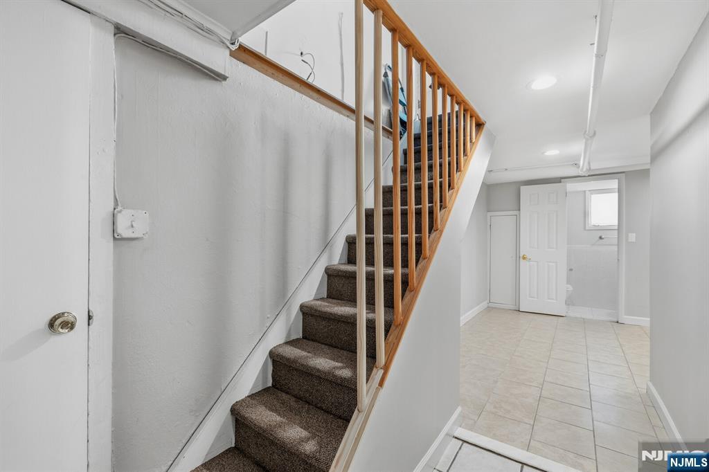 346 Carmita Avenue Rutherford, NJ 07070 - Photo 30 of 47 a view of entryway and hall with wooden floor