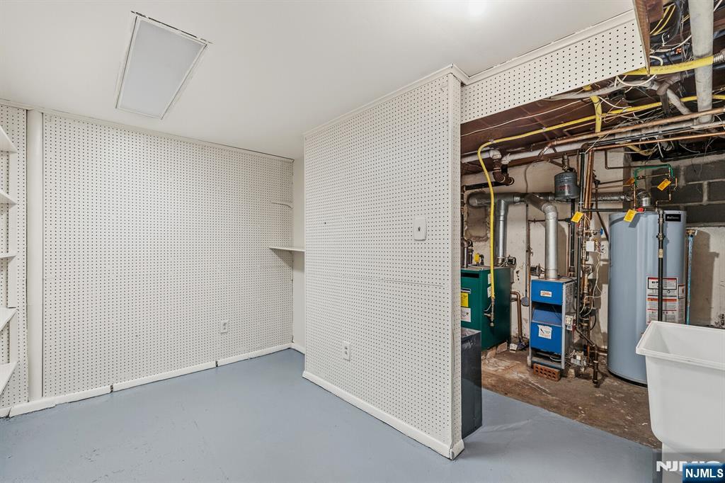 346 Carmita Avenue Rutherford, NJ 07070 - Photo 31 of 47 a view of walk in closet with clothes and shoes